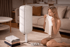 “Zylo Portable Clothes Dryer compact setup with hanging clothes inside fabric cover”