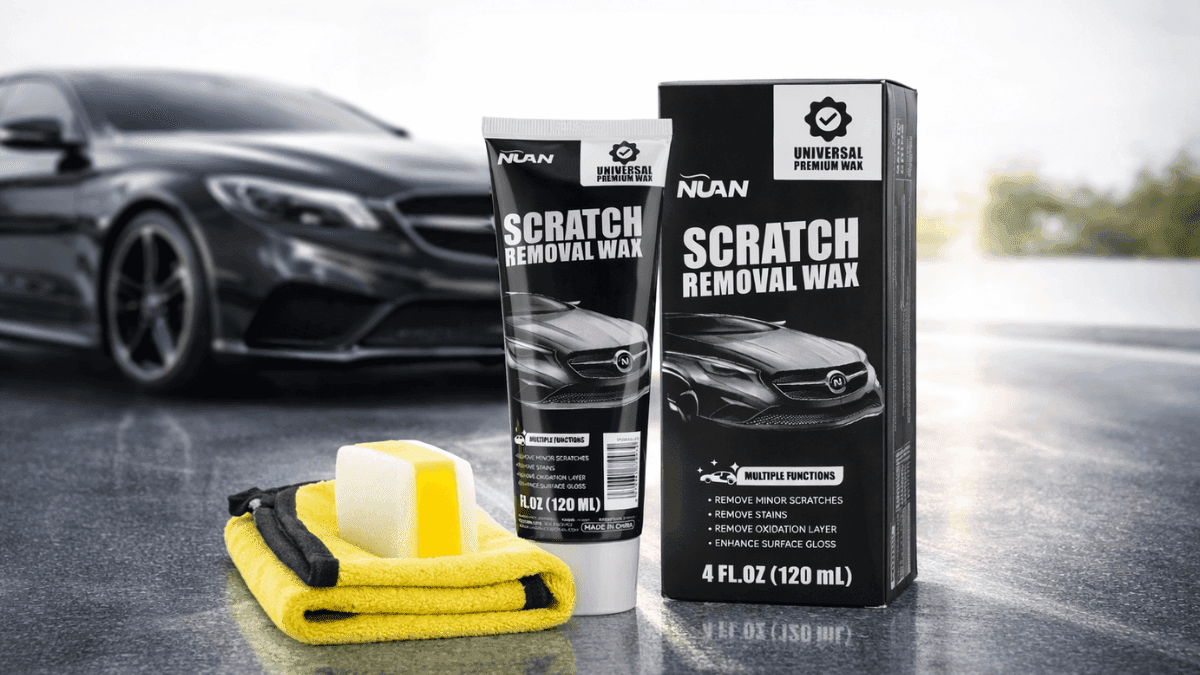 NUAN Car Scratch Removal Wax 120 mL kit with tube, box packaging, foam applicator pad, and yellow microfiber cloth displayed in front of a black car on a glossy surface.